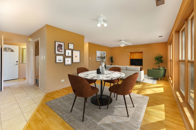 2S154 Lloyd Ave, Lombard, IL 60148 - dining space with baseboards, ceiling fan, and light wood-style flooring