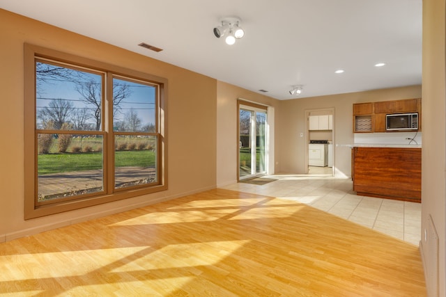 2S154 Lloyd Ave, Lombard, IL 60148 - unfurnished living room featuring baseboards, recessed lighting, light tile patterned flooring, and visible vents