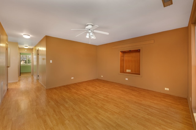 2S154 Lloyd Ave, Lombard, IL 60148 - empty room with a ceiling fan, baseboards, and light wood-style flooring