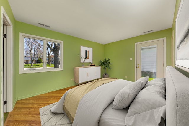 2S154 Lloyd Ave, Lombard, IL 60148 - bedroom with baseboards, visible vents, and wood finished floors