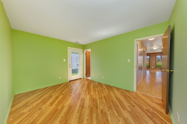 2S154 Lloyd Ave, Lombard, IL 60148 - spare room with baseboards, light wood finished floors, and visible vents
