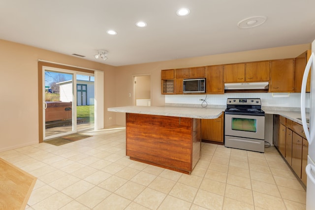 2S154 Lloyd Ave, Lombard, IL 60148 - kitchen with appliances with stainless steel finishes, brown cabinets, light countertops, under cabinet range hood, and recessed lighting