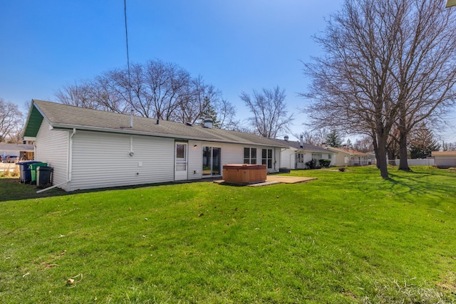 2S154 Lloyd Ave, Lombard, IL 60148 - rear view of property featuring a lawn, a chimney, and a hot tub