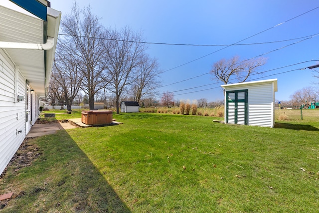 2S154 Lloyd Ave, Lombard, IL 60148 - view of yard with an outdoor structure, a hot tub, and a storage shed