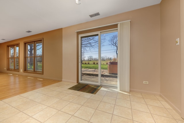 2S154 Lloyd Ave, Lombard, IL 60148 - doorway featuring baseboards, visible vents, and a wealth of natural light