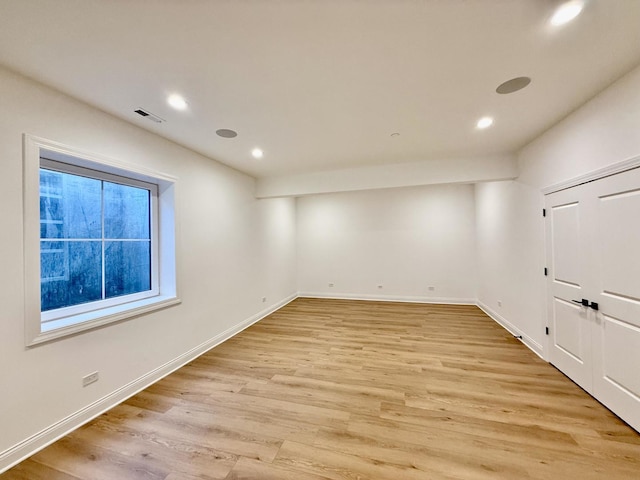 spare room featuring visible vents, baseboards, light wood finished floors, and recessed lighting