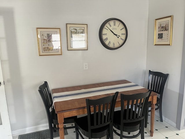 dining room featuring baseboards