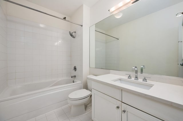 full bath featuring washtub / shower combination, tile patterned flooring, vanity, and toilet