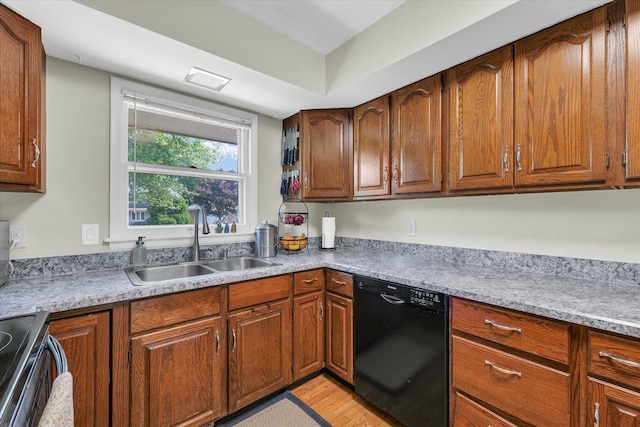 kitchen with black dishwasher, a sink, stainless steel range with electric stovetop, light countertops, and brown cabinets