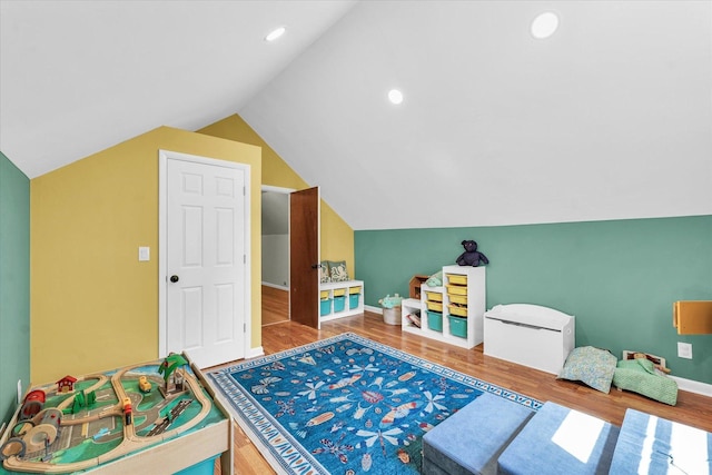 rec room with wood finished floors, lofted ceiling, baseboards, and recessed lighting