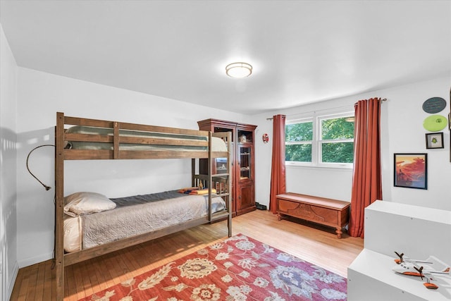 bedroom with wood finished floors