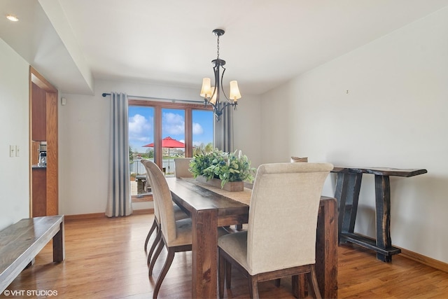 22846 W Lochanora Dr, Hawthorn Woods, IL 60047 - dining area with a chandelier, light wood finished floors, and baseboards