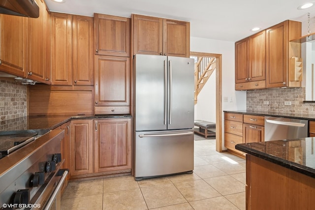 22846 W Lochanora Dr, Hawthorn Woods, IL 60047 - kitchen featuring appliances with stainless steel finishes, recessed lighting, tasteful backsplash, dark stone counters, and brown cabinets