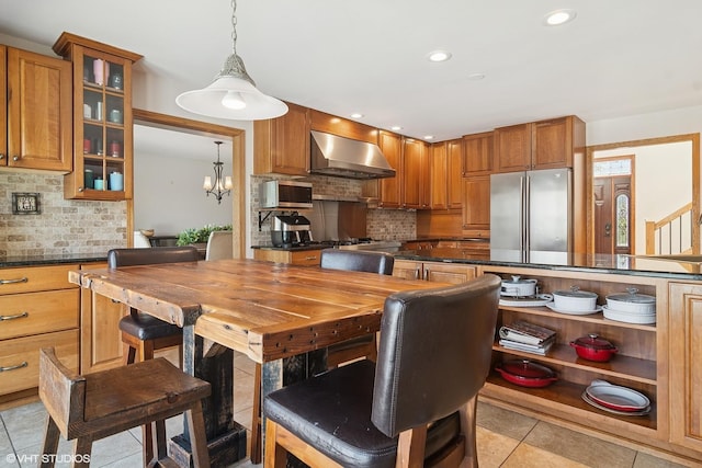 22846 W Lochanora Dr, Hawthorn Woods, IL 60047 - kitchen with wall chimney exhaust hood, appliances with stainless steel finishes, open shelves, backsplash, and light tile patterned floors