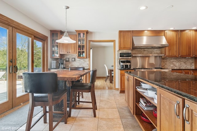 22846 W Lochanora Dr, Hawthorn Woods, IL 60047 - kitchen featuring range hood, tasteful backsplash, hanging light fixtures, dark stone counters, and french doors