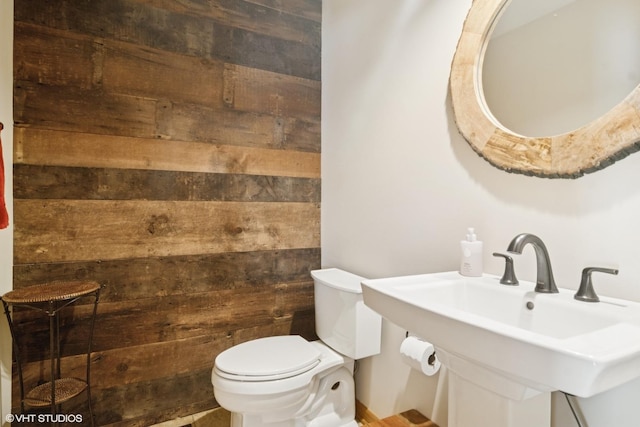 22846 W Lochanora Dr, Hawthorn Woods, IL 60047 - bathroom featuring wooden walls, toilet, and a sink