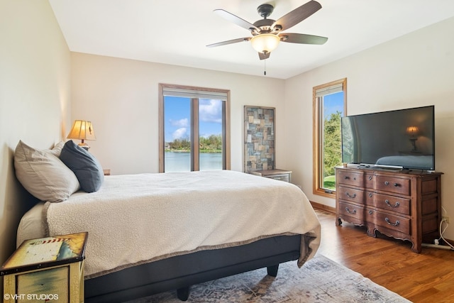 22846 W Lochanora Dr, Hawthorn Woods, IL 60047 - bedroom featuring wood finished floors, multiple windows, ceiling fan, and baseboards