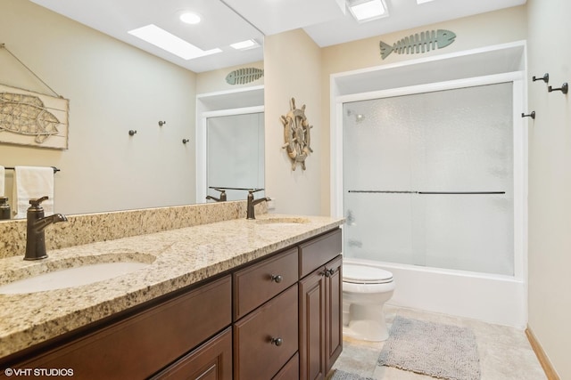 22846 W Lochanora Dr, Hawthorn Woods, IL 60047 - full bathroom featuring toilet, a skylight, double vanity, and bath / shower combo with glass door