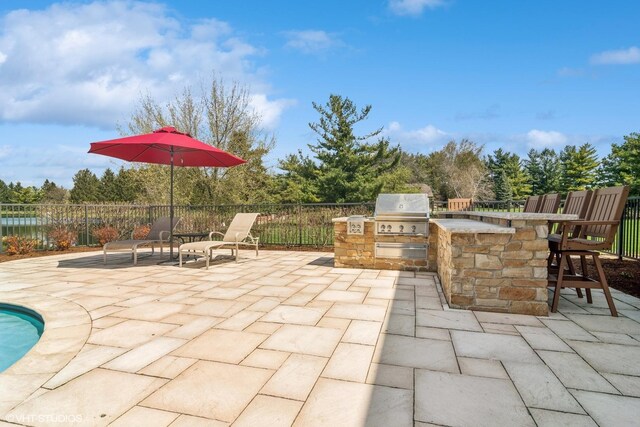 22846 W Lochanora Dr, Hawthorn Woods, IL 60047 - view of patio with exterior kitchen, a grill, and fence