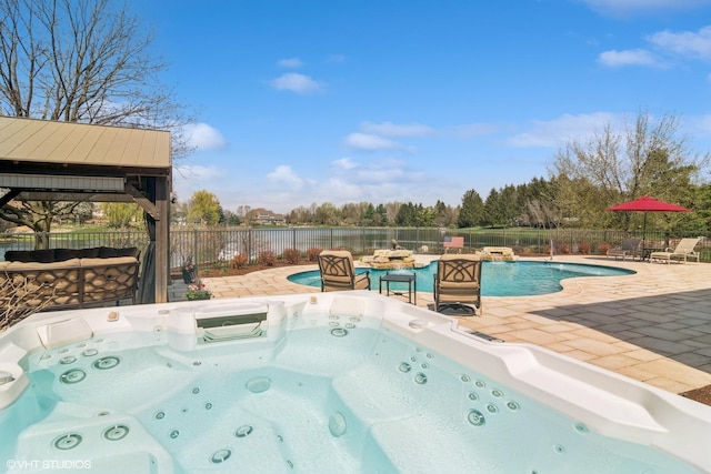 22846 W Lochanora Dr, Hawthorn Woods, IL 60047 - view of pool featuring a hot tub, a patio, a fenced backyard, and a water view