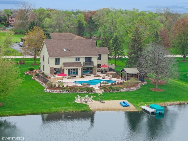 22846 W Lochanora Dr, Hawthorn Woods, IL 60047 - back of house featuring an outdoor fire pit, an outdoor pool, a water view, a balcony, and a patio area