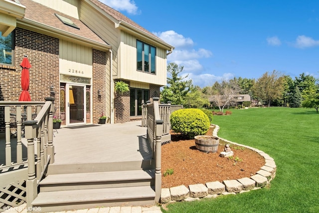 22846 W Lochanora Dr, Hawthorn Woods, IL 60047 - property entrance featuring brick siding, a yard, a deck, and a shingled roof