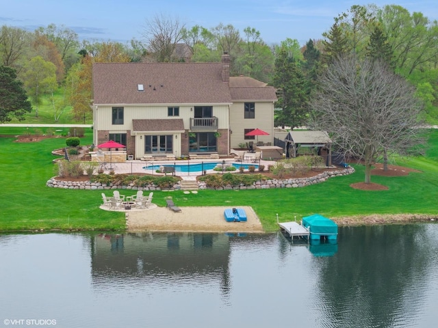 22846 W Lochanora Dr, Hawthorn Woods, IL 60047 - back of house featuring a balcony, a patio area, an outdoor pool, a fire pit, and a water view