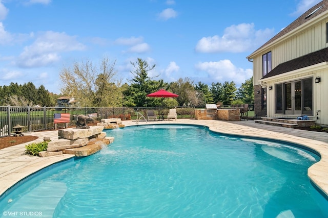 22846 W Lochanora Dr, Hawthorn Woods, IL 60047 - view of pool featuring an outdoor kitchen, a patio, fence, and french doors