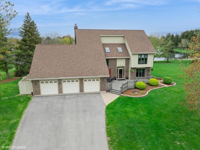 22846 W Lochanora Dr, Hawthorn Woods, IL 60047 - view of front of home with brick siding, a front yard, driveway, a shingled roof, and a garage