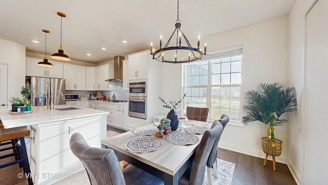 dining room with baseboards, recessed lighting, a notable chandelier, and dark wood finished floors
