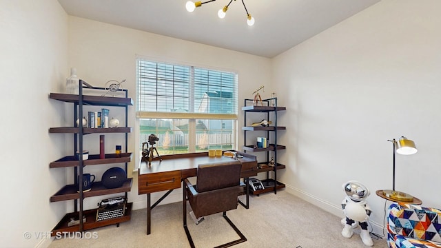 office area with baseboards, carpet flooring, and a notable chandelier