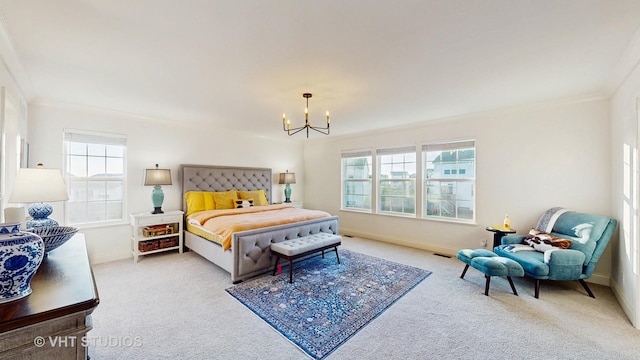 carpeted bedroom with baseboards, multiple windows, and an inviting chandelier