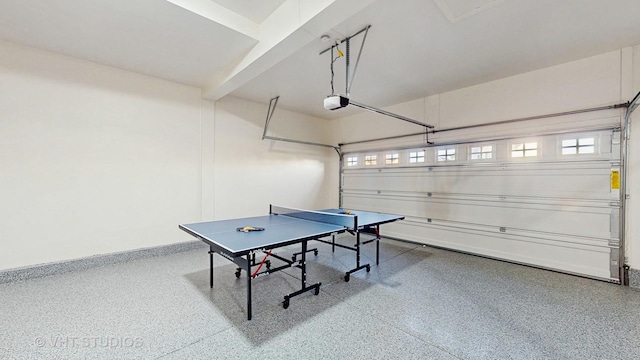 rec room with a garage, baseboards, and speckled floor