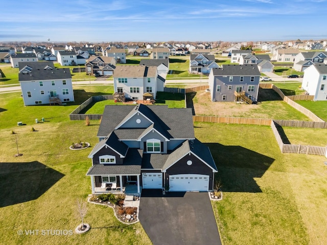 birds eye view of property with a residential view