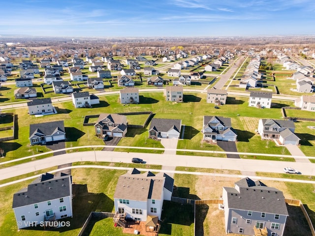 birds eye view of property with a residential view
