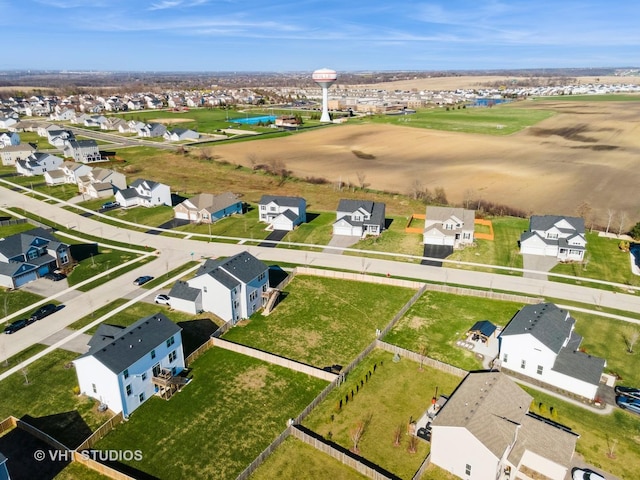 drone / aerial view with a residential view and a water view