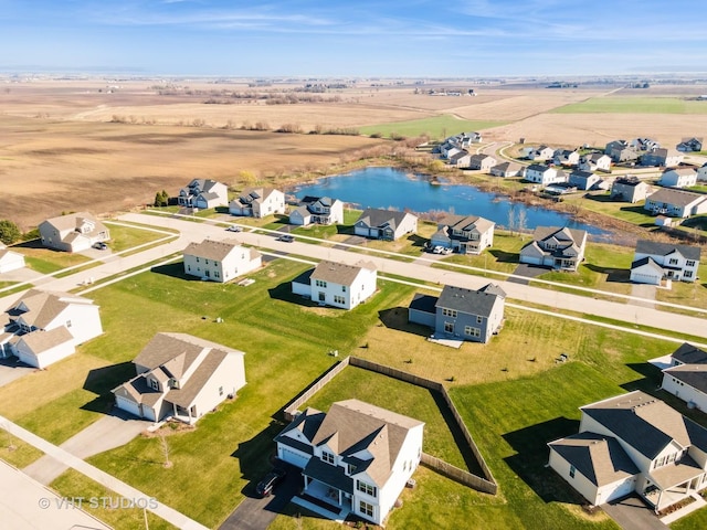 aerial view with a water view and a residential view