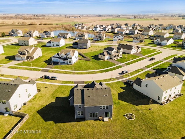 aerial view featuring a water view and a residential view