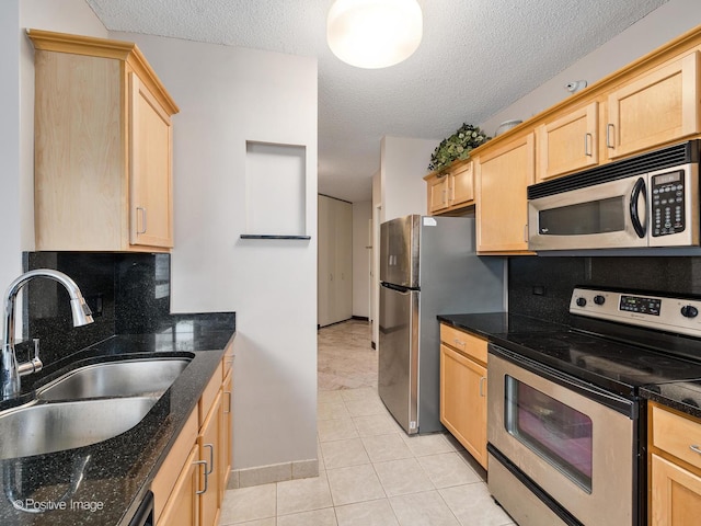 222 N Columbus Dr Unit 809, Chicago, IL 60601 - kitchen with appliances with stainless steel finishes, decorative backsplash, light brown cabinetry, and a sink