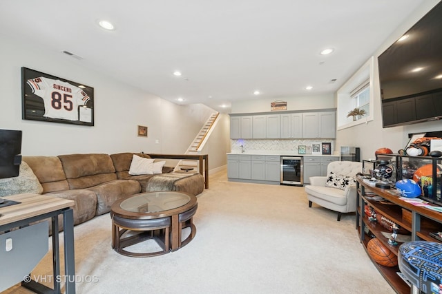 2733 N Maplewood Ave, Chicago, IL 60647 - living room with stairs, beverage cooler, recessed lighting, and light colored carpet