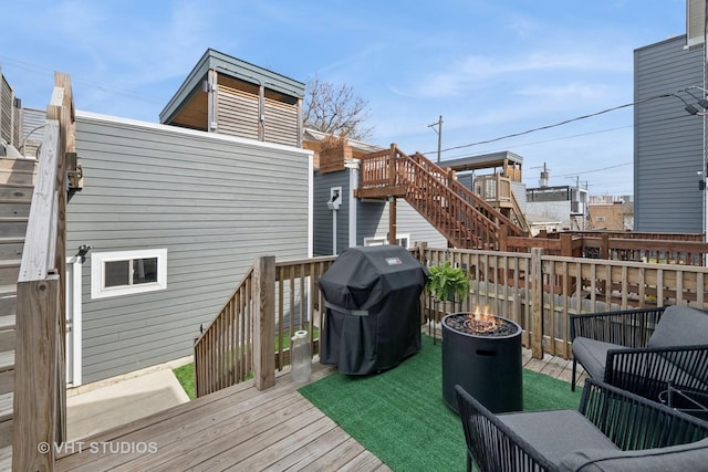 2733 N Maplewood Ave, Chicago, IL 60647 - wooden terrace featuring a fire pit, area for grilling, and stairway