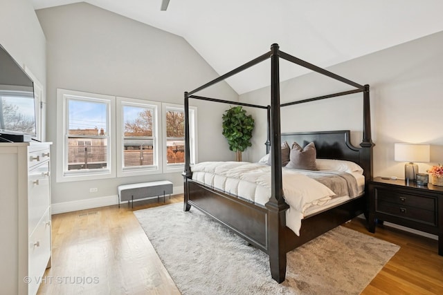 2733 N Maplewood Ave, Chicago, IL 60647 - bedroom with lofted ceiling, visible vents, baseboards, and wood finished floors