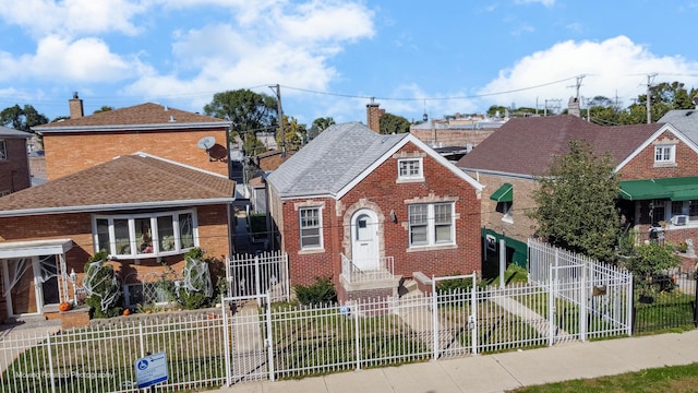 2434 W 47th Pl, Chicago, IL 60632 - view of front of property featuring a chimney, a shingled roof, a fenced front yard, and brick siding