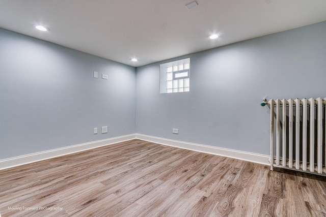 2434 W 47th Pl, Chicago, IL 60632 - empty room featuring recessed lighting, baseboards, radiator, and wood finished floors