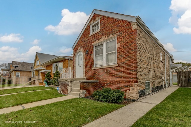 2434 W 47th Pl, Chicago, IL 60632 - bungalow with a front yard, brick siding, and fence