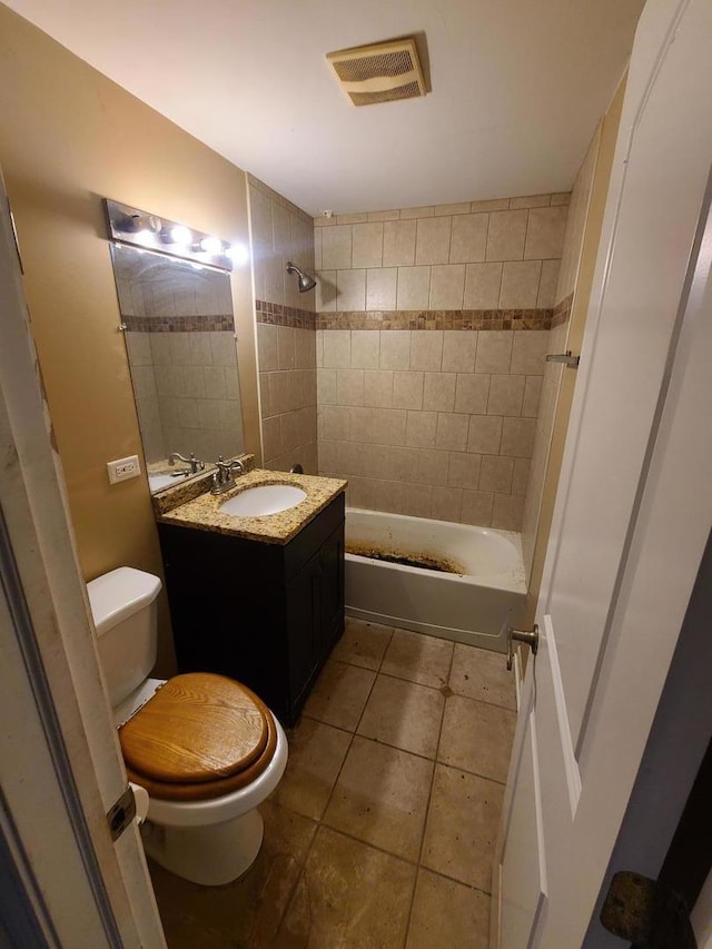 bathroom with visible vents, toilet, shower / bathing tub combination, vanity, and tile patterned flooring