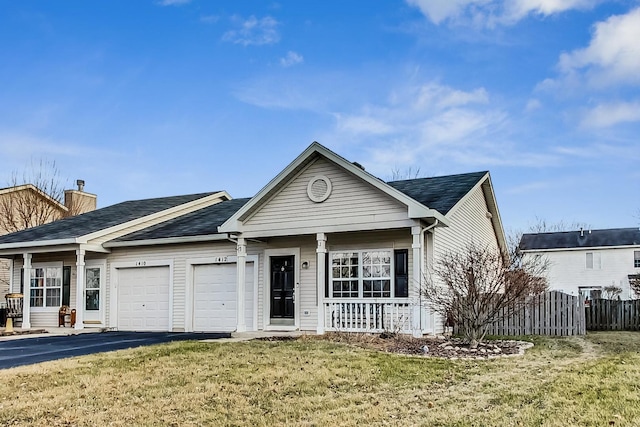 1412 Plantain Dr, Minooka, IL 60447 - view of front facade featuring a chimney, fence, a front lawn, an attached garage, and covered porch
