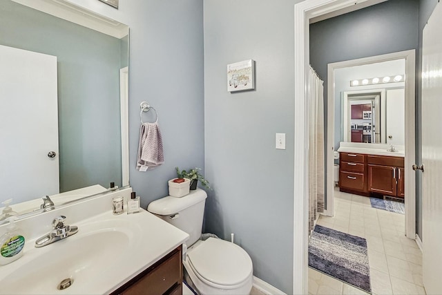 1412 Plantain Dr, Minooka, IL 60447 - full bath with tile patterned flooring, toilet, vanity, baseboards, and a shower with shower curtain