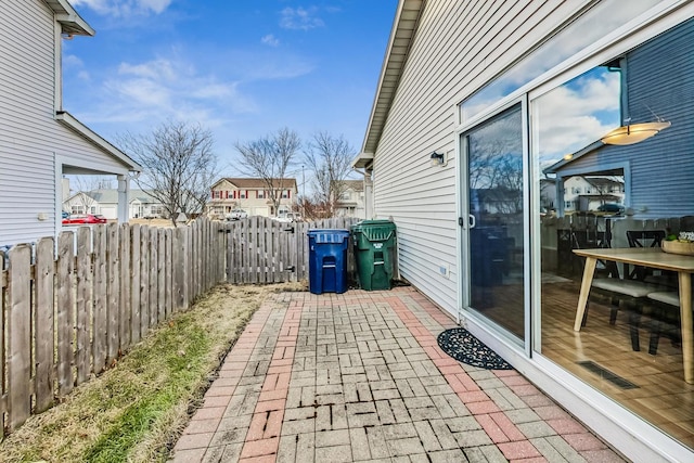 1412 Plantain Dr, Minooka, IL 60447 - view of patio / terrace featuring a gate, fence, and a residential view