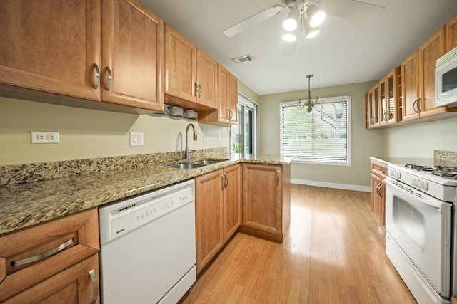 924 Coach Rd Unit 1, Palatine, IL 60074 - kitchen with white appliances, a sink, ceiling fan, light wood-style floors, and baseboards